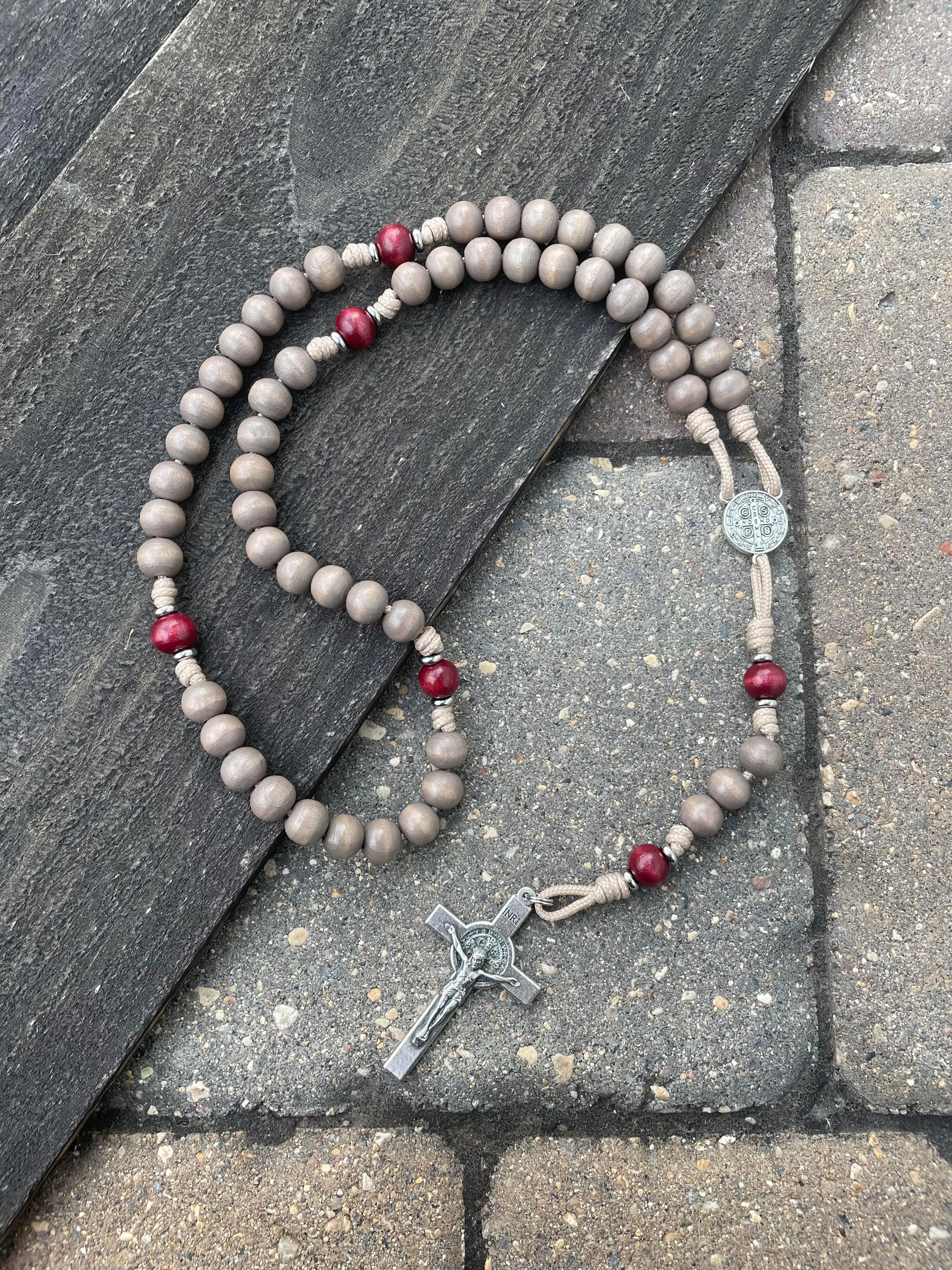 Handmade Bethlehem Christmas rosary crafted in Fargo ND with red-gray wood beads and silver crucifix