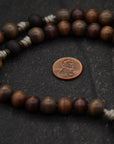 Handcrafted wooden rosary with desert tan paracord and copper St. Benedict crucifix