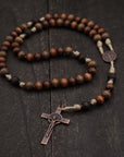 Handcrafted wooden rosary with desert tan paracord and copper St. Benedict crucifix
