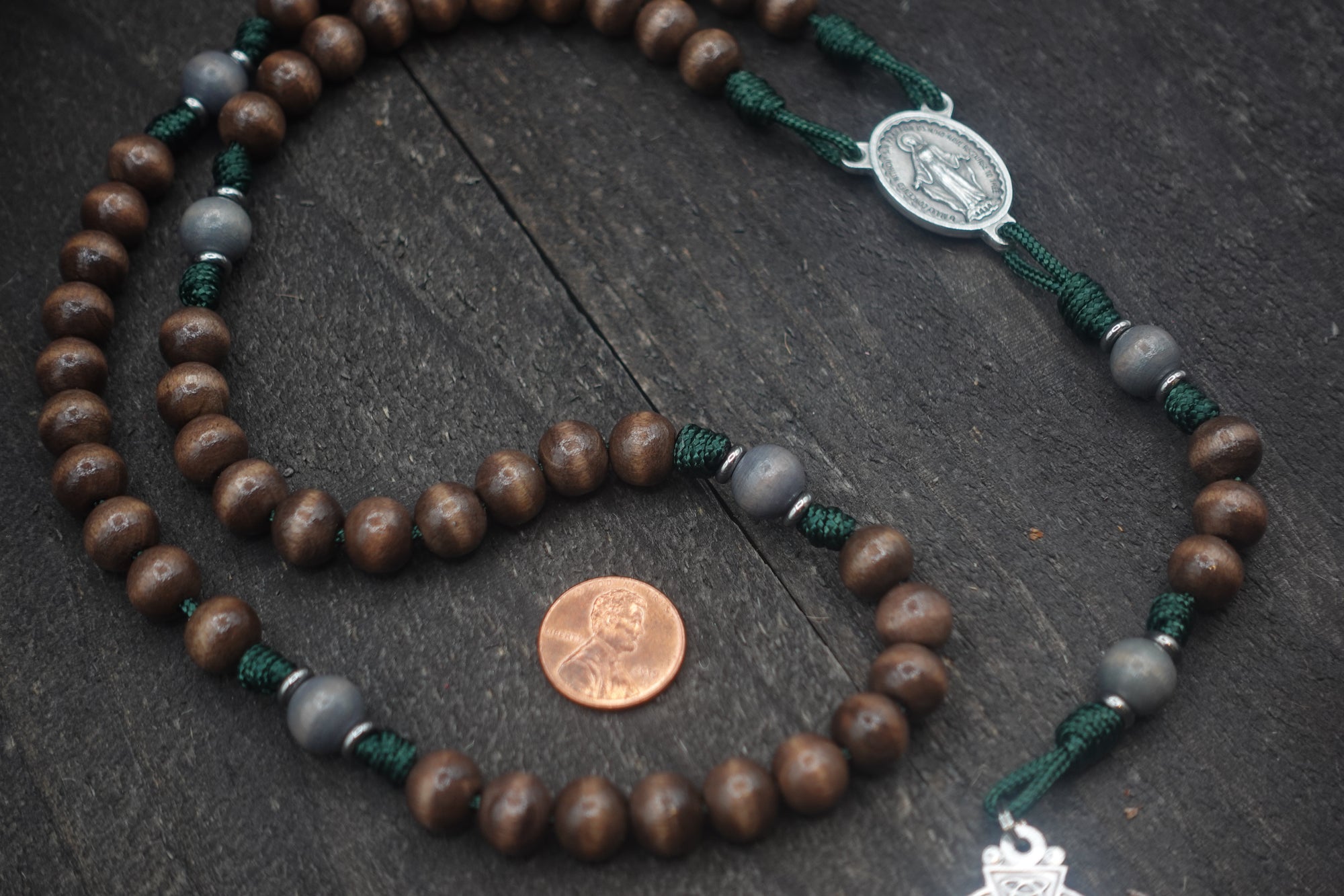 Rugged Celtic rosary built for daily prayer with silver crucifix and gray-brown wood beads