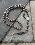 Rugged handcrafted rosary built for daily prayer with silver crucifix and charcoal wooden beads