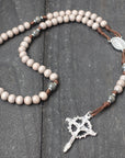 Durable walnut paracord rosary built for daily prayer with silver crucifix and charcoal wooden beads