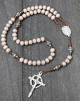 Handcrafted Holy Sepulcher rosary for daily prayer featuring silver crucifix and charcoal wood beads