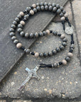 Rosary for the Holy Souls with light gray and charcoal wooden beads, silver St. Benedict crucifix, and black paracord