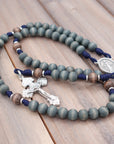 Handcrafted King of Glory rosary for daily prayer featuring silver crucifix and gray-blue wooden beads