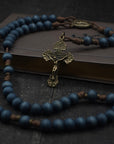 Handcrafted rosary featuring blue wood beads with bronze crucifix and Miraculous Medal centerpiece