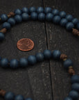 Wood bead detail showing unique tone and grain on handmade Lepanto rosary