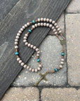 Noel Christmas rosary with teal and gray wooden beads, bronze St. Benedict crucifix, and durable paracord