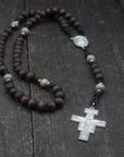 Handcrafted padre pio rosary featuring walnut-stained Hail Mary beads, gray Our Father beads, and Padre Pio medal centerpiece