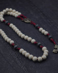 Handcrafted Pope Leo XIV rosary for daily prayer featuring bronze crucifix and vintage white wood beads