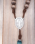 Miraculous Medal centerpiece detail on St. Kateri Tekakwitha rosary with silver hardware and wooden beads