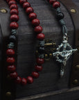 Durable paracord rosary built for daily prayer with silver hardware and red-black stained wooden beads
