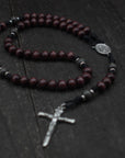 Rugged handmade Terror of Demons rosary crafted in Fargo ND with silver crucifix and dark wooden beads