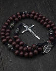 Terror of Demons rosary by Runewood Rosary combining dark wood beads, silver crucifix, and black paracord for faithful devotion