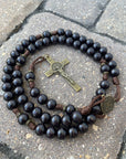 Black Benedictine rosary with black wooden beads, bronze St. Benedict crucifix, and durable walnut paracord