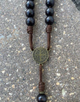 Bronze St. Benedict medal centerpiece detail on Black Benedictine rosary with black wooden beads