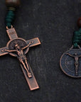Copper crucifix detail on durable paracord rosary with mixed brown wooden beads