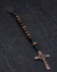 Compact paracord rosary for men, featuring copper hardware and mixed brown wood beads
