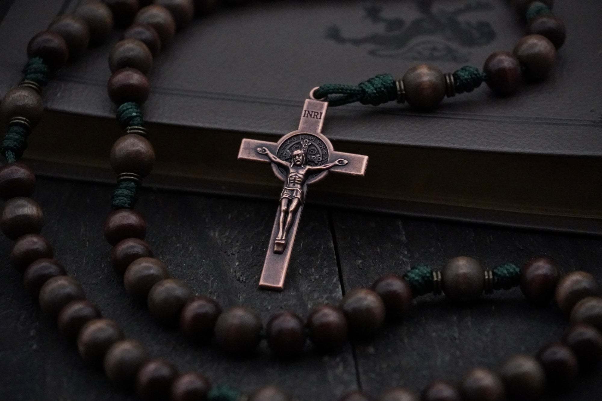 Durable 95 paracord rosary built for outdoorsmen with copper St. Benedict crucifix and wooden beads