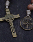 Up close view of bronze St. Benedict crucifix and medal on wooden one decade rosary