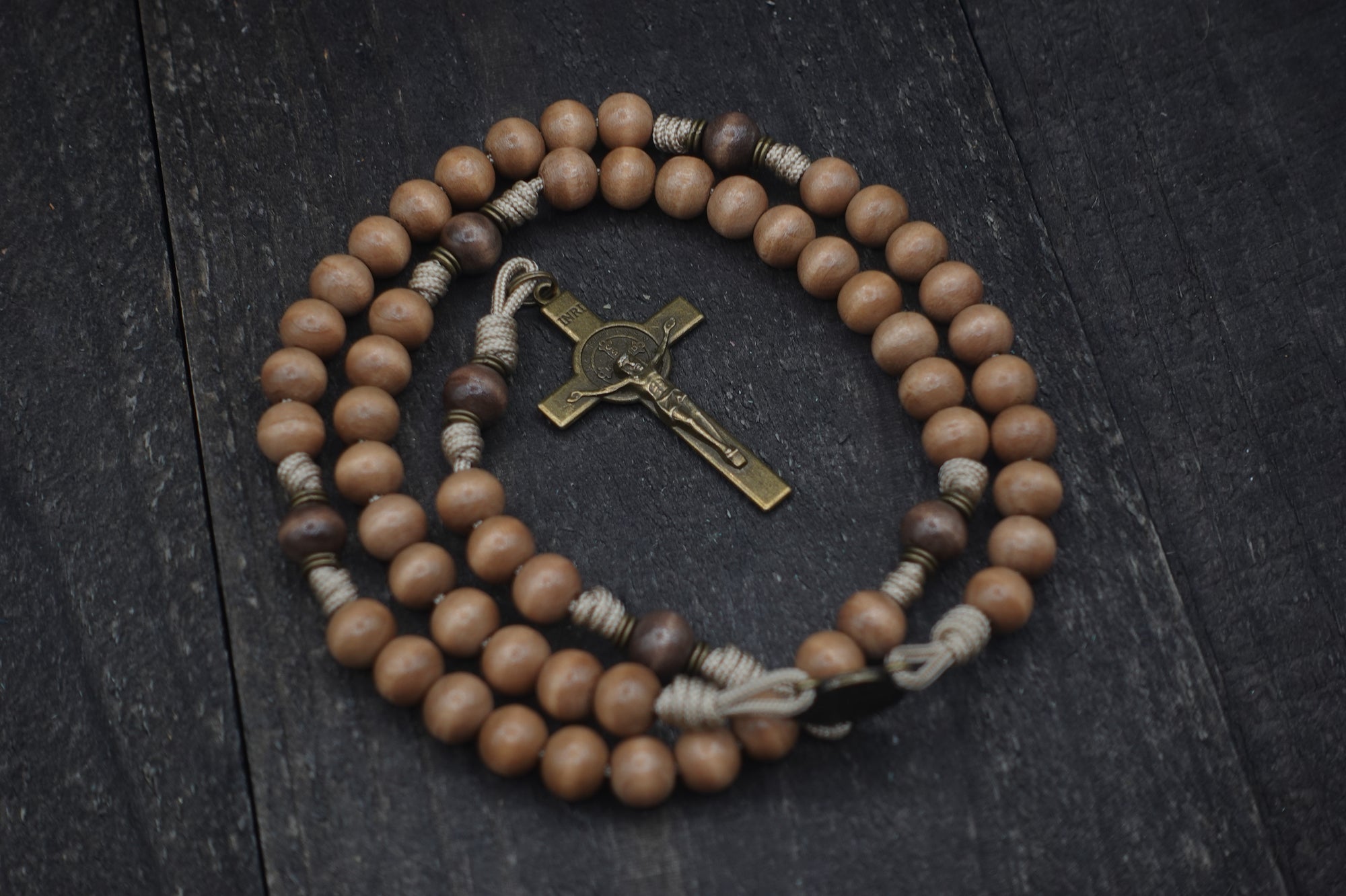 Road to Damascus paracord rosary with tan and gray-brown wooden beads and bronze St. Benedict crucifix, handcrafted in Fargo ND