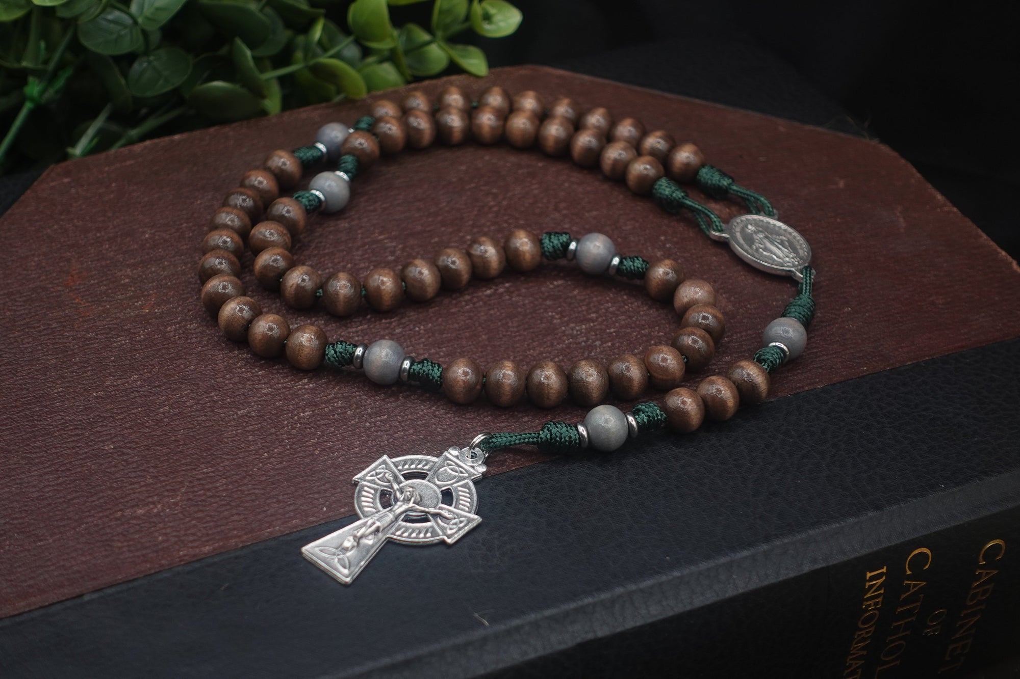 Celtic Catholic rosary with gray-brown and lunar gray wood beads, silver oxidized crucifix, and green paracord