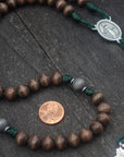 Rugged Celtic rosary built for daily prayer with silver crucifix and gray-brown wood beads