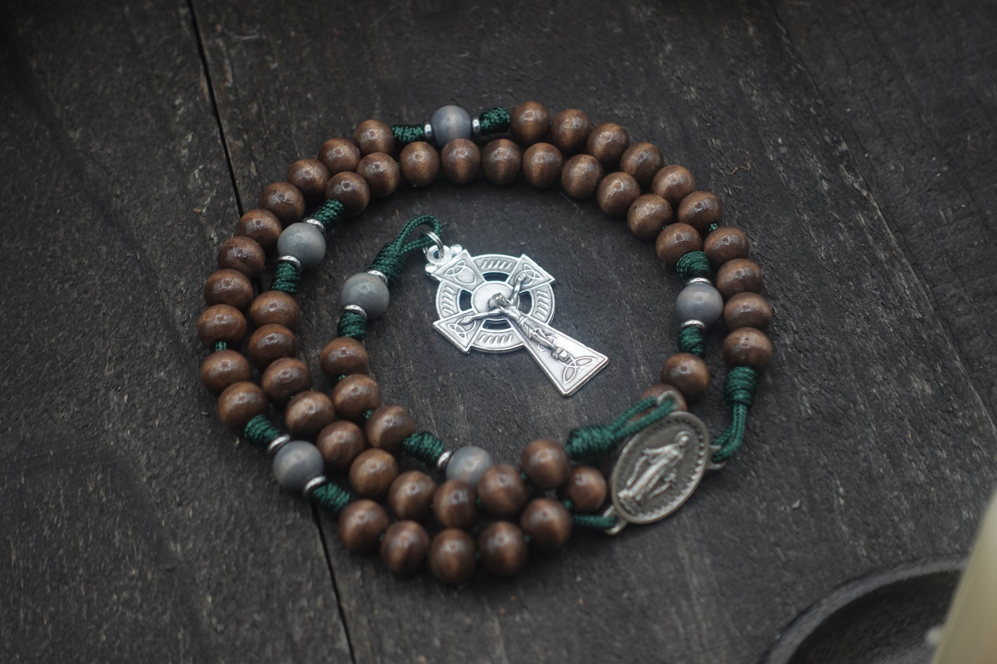 Handcrafted Celtic Catholic rosary for daily prayer featuring silver crucifix and wooden beads