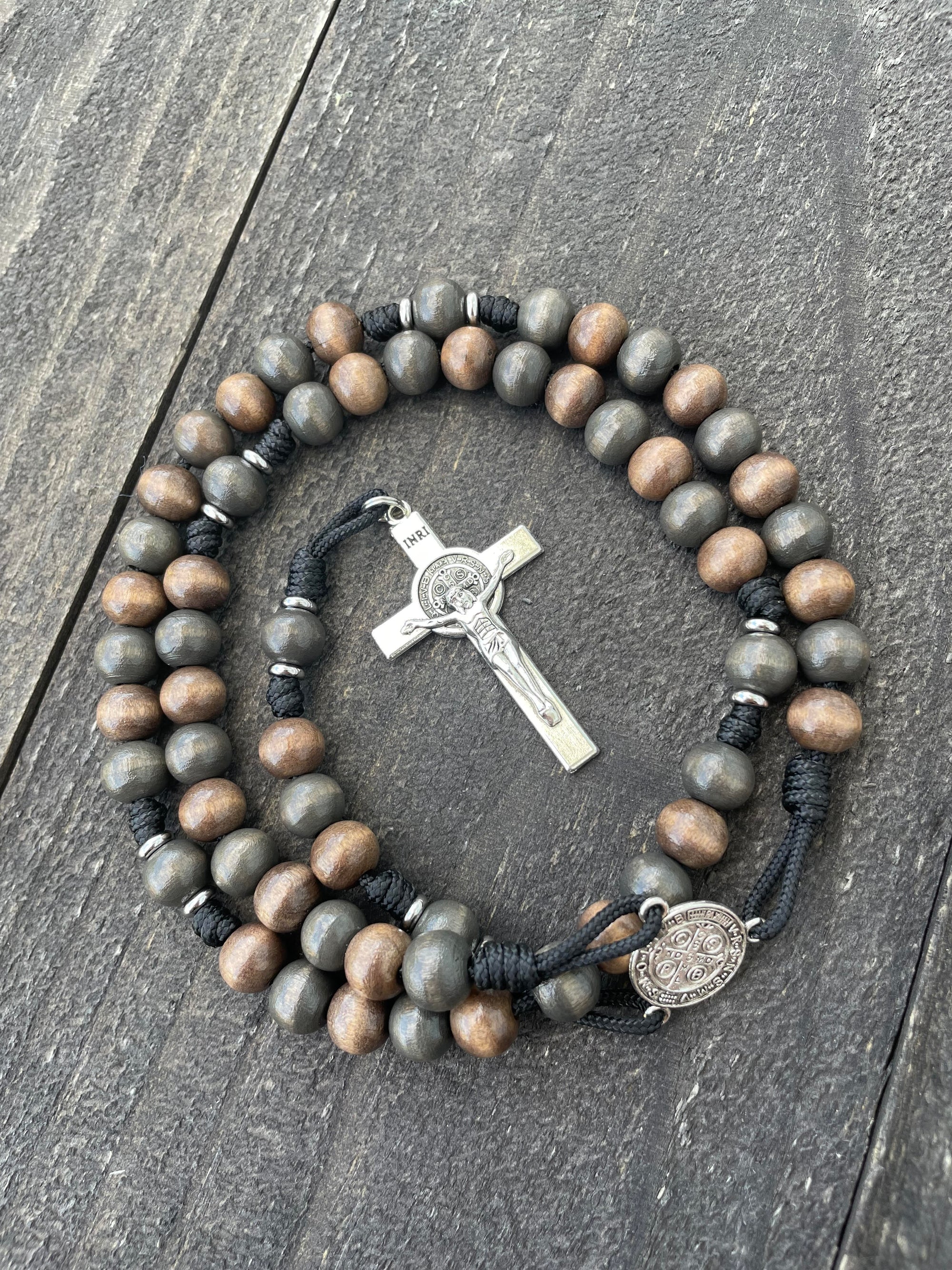 Oxidized silver St. Benedict crucifix detail on durable black paracord rosary crafted in Fargo ND