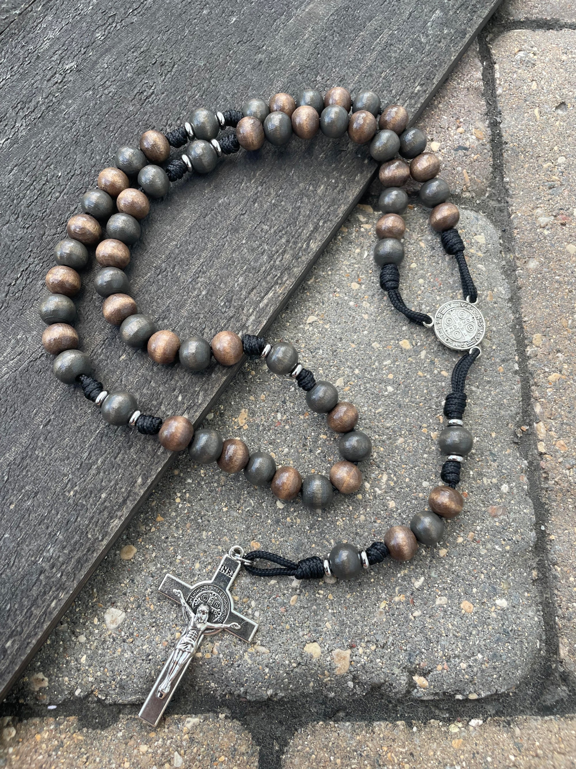 Rugged handcrafted rosary built for daily prayer with silver crucifix and charcoal wooden beads