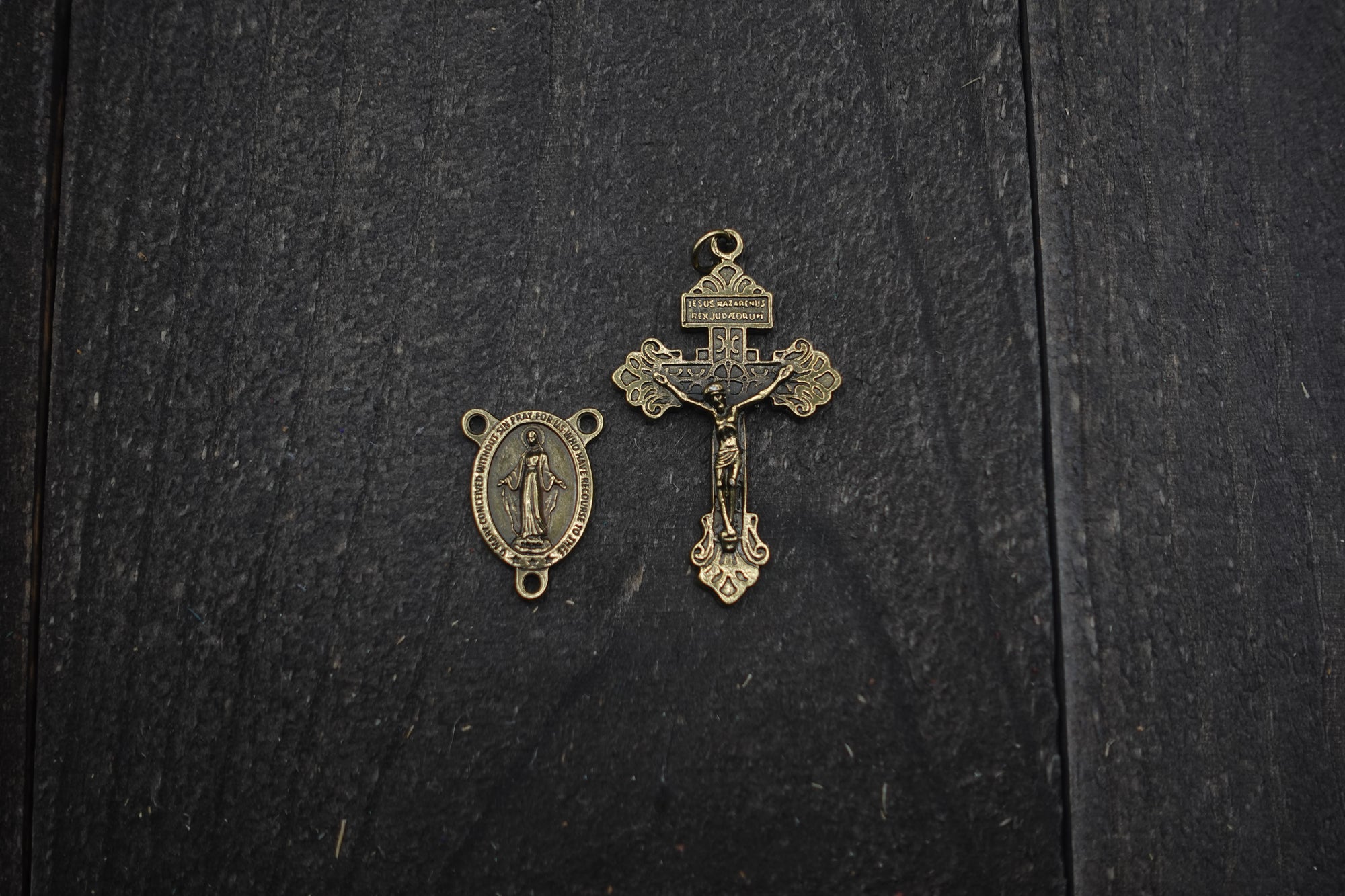 Bronze crucifix detail symbolizing grace and devotion on handmade Heavenly Grace rosary