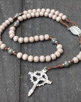 Holy Sepulcher rosary with charcoal and black wooden beads, silver Crown of Thorns crucifix, and walnut paracord