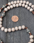 Handcrafted rosary featuring charcoal-stained wood beads, silver crucifix, and Miraculous Medal centerpiece