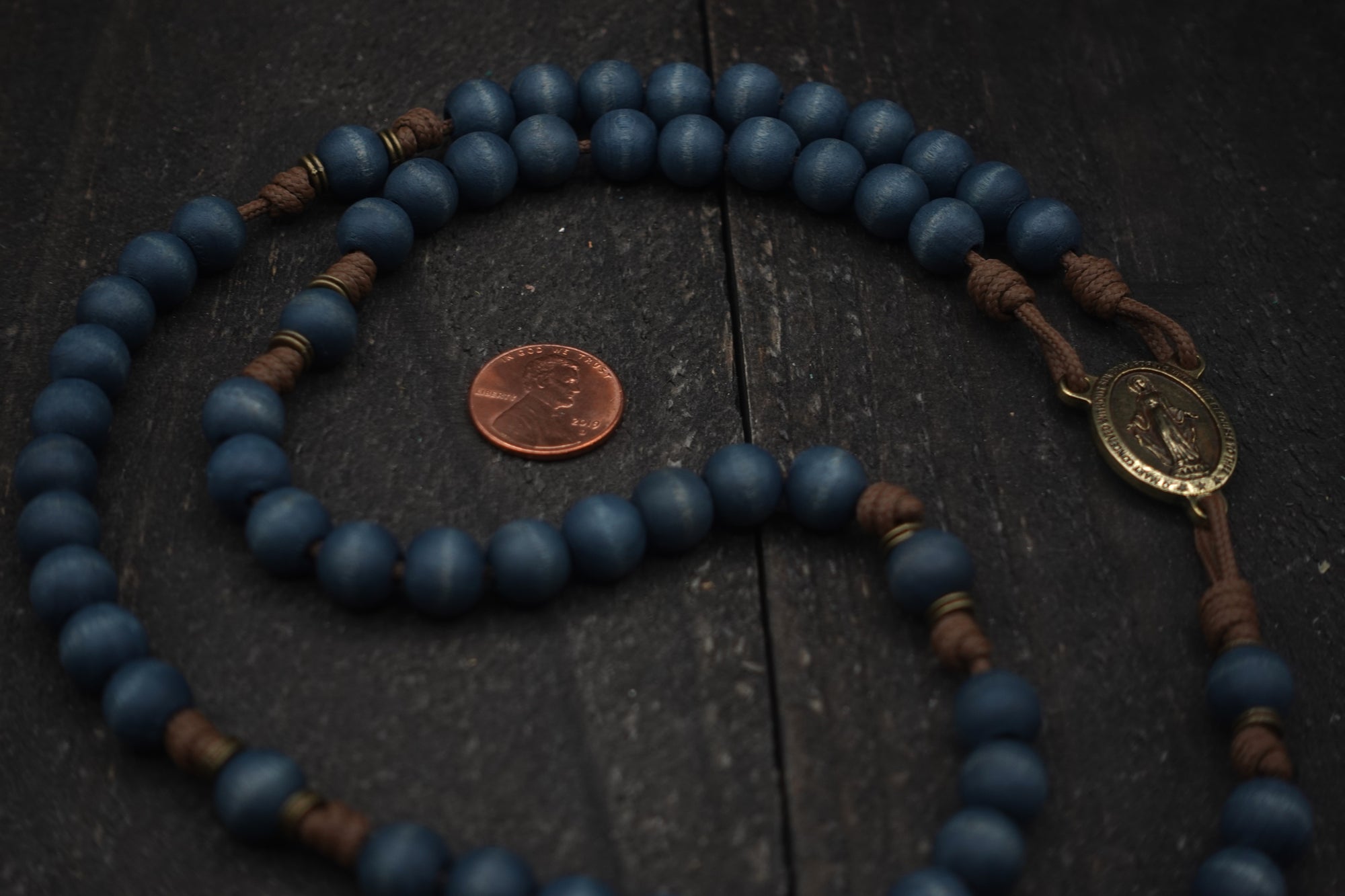 Wood bead detail showing unique tone and grain on handmade Lepanto rosary