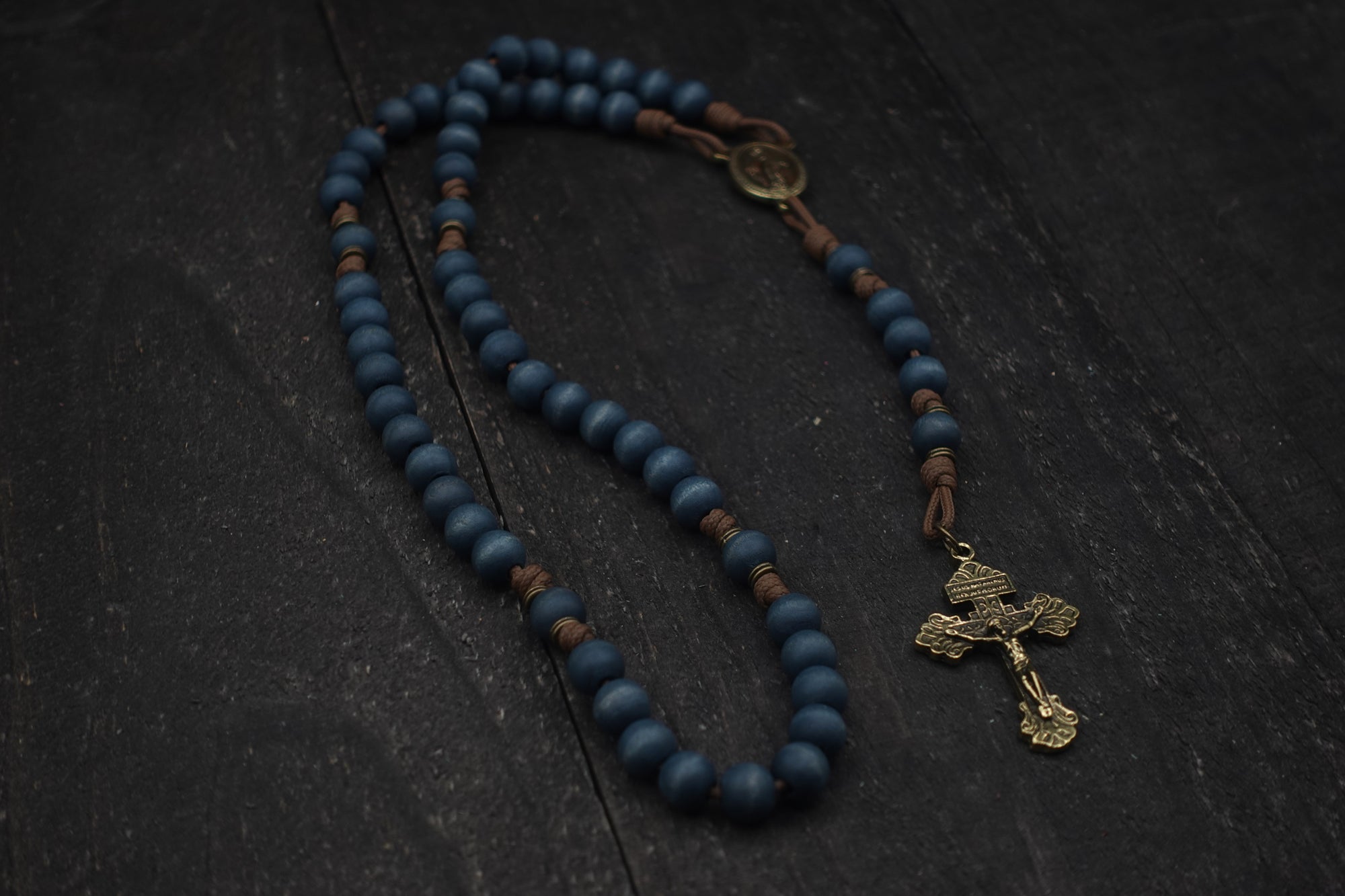 Handcrafted Lepanto Catholic rosary for daily prayer featuring bronze crucifix and blue wooden beads