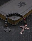 Pocket Logos rosary with charcoal and red-brown wooden beads, bronze Pardon Crucifix, and Miraculous Medal
