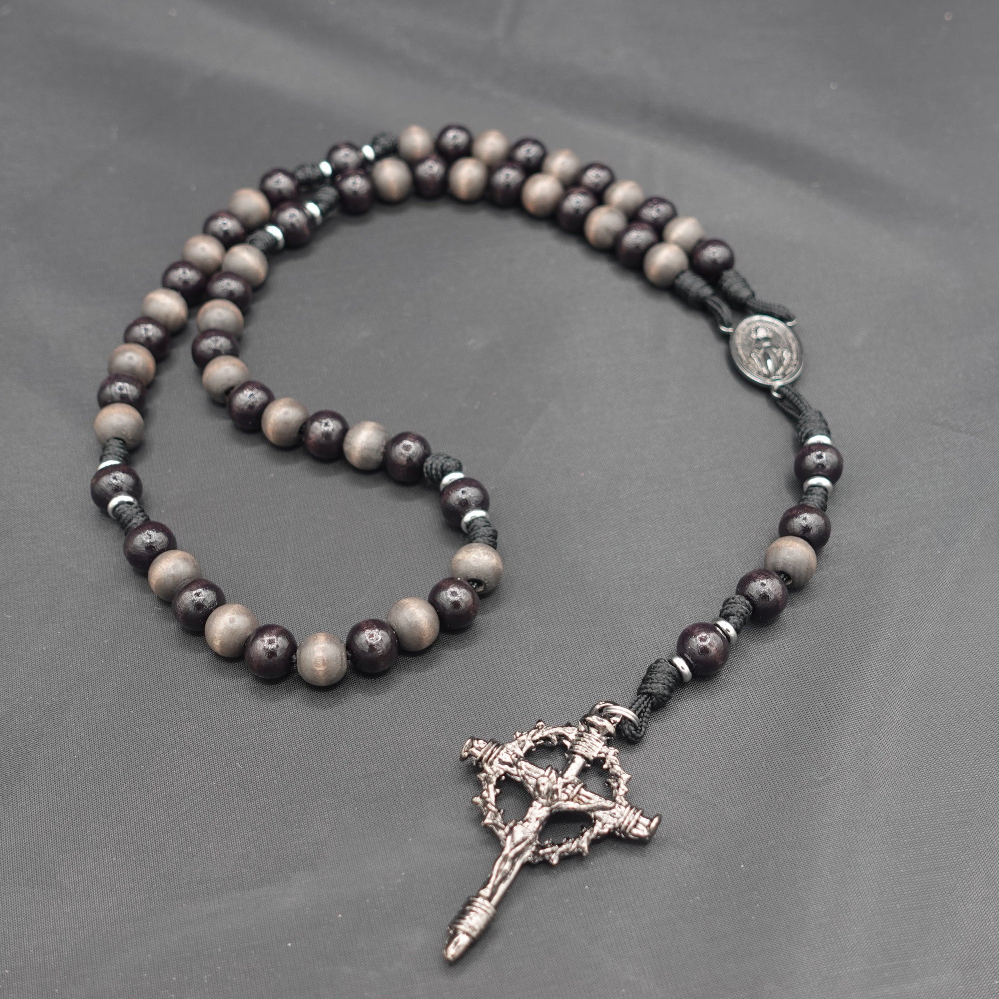 Rugged handmade Memento Mori rosary crafted in Fargo ND with silver crucifix and charcoal wood beads