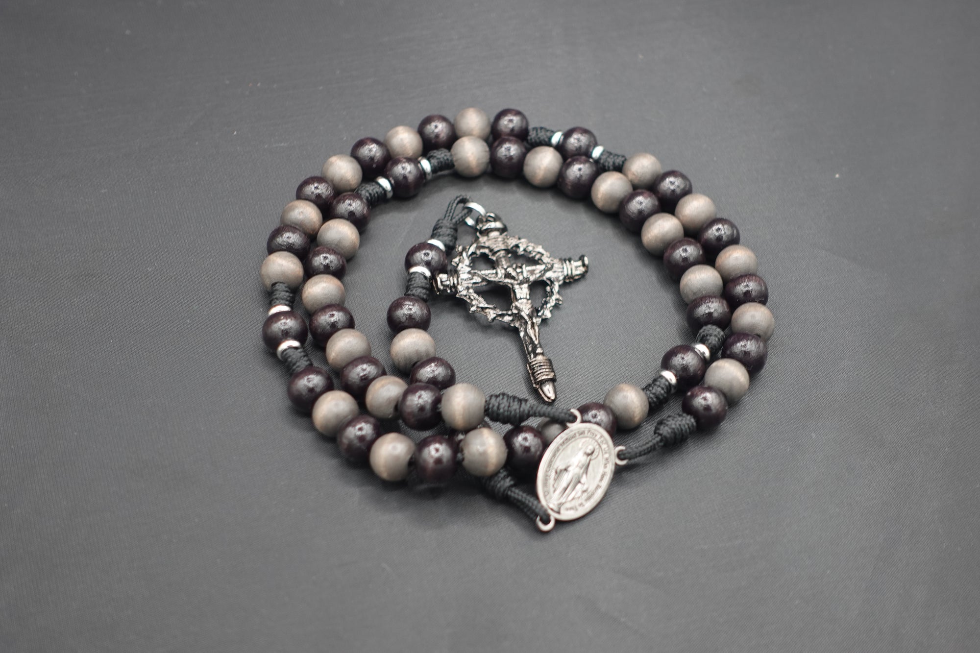 Memento Mori rosary by Runewood Rosary combining dark wooden beads and silver crucifix for faithful devotion