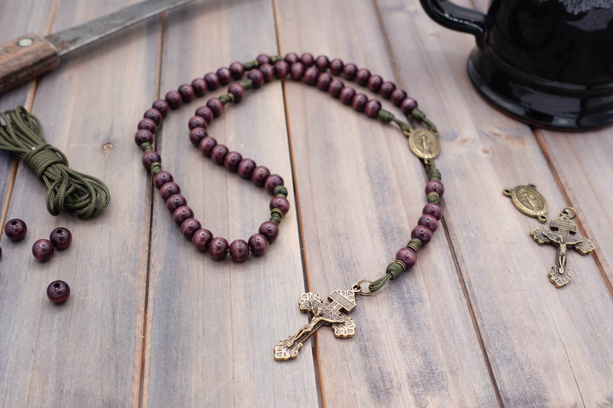Mount of Olives rosary with burgundy wooden beads, bronze Pardon crucifix, and olive drab paracord