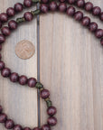 Wood bead and bronze spacer detail showing natural stain variation on handmade Mount of Olives rosary