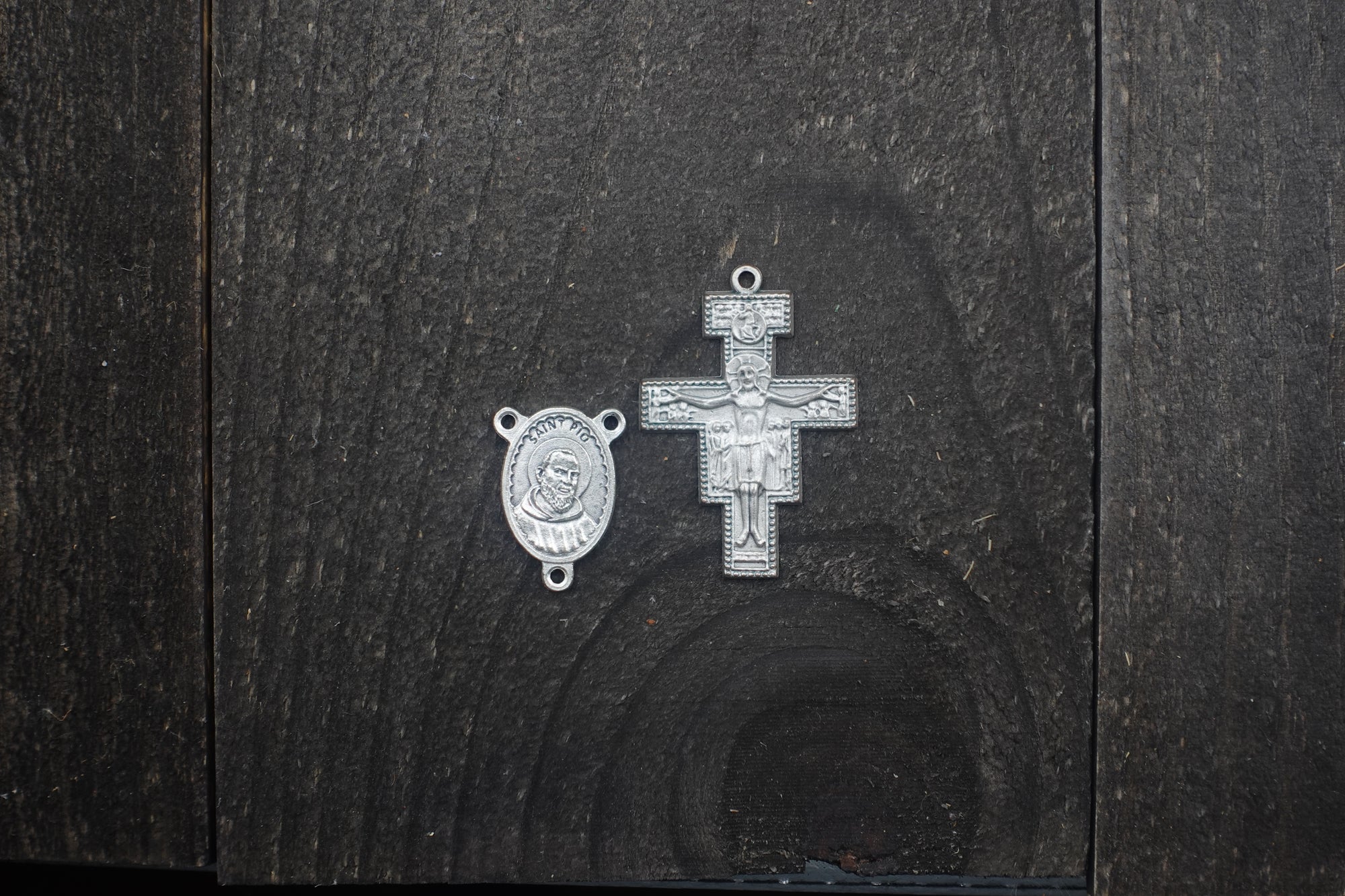 Silver San Damiano crucifix detail symbolizing faith and service on handmade Padre Pio rosary