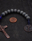 Durable navy paracord rosary with lunar and royal blue stained beads and copper hardware built to last