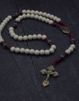 Handcrafted rosary inspired by Pope Leo XIV featuring white and charcoal wood beads with bronze crucifix and medal centerpiece