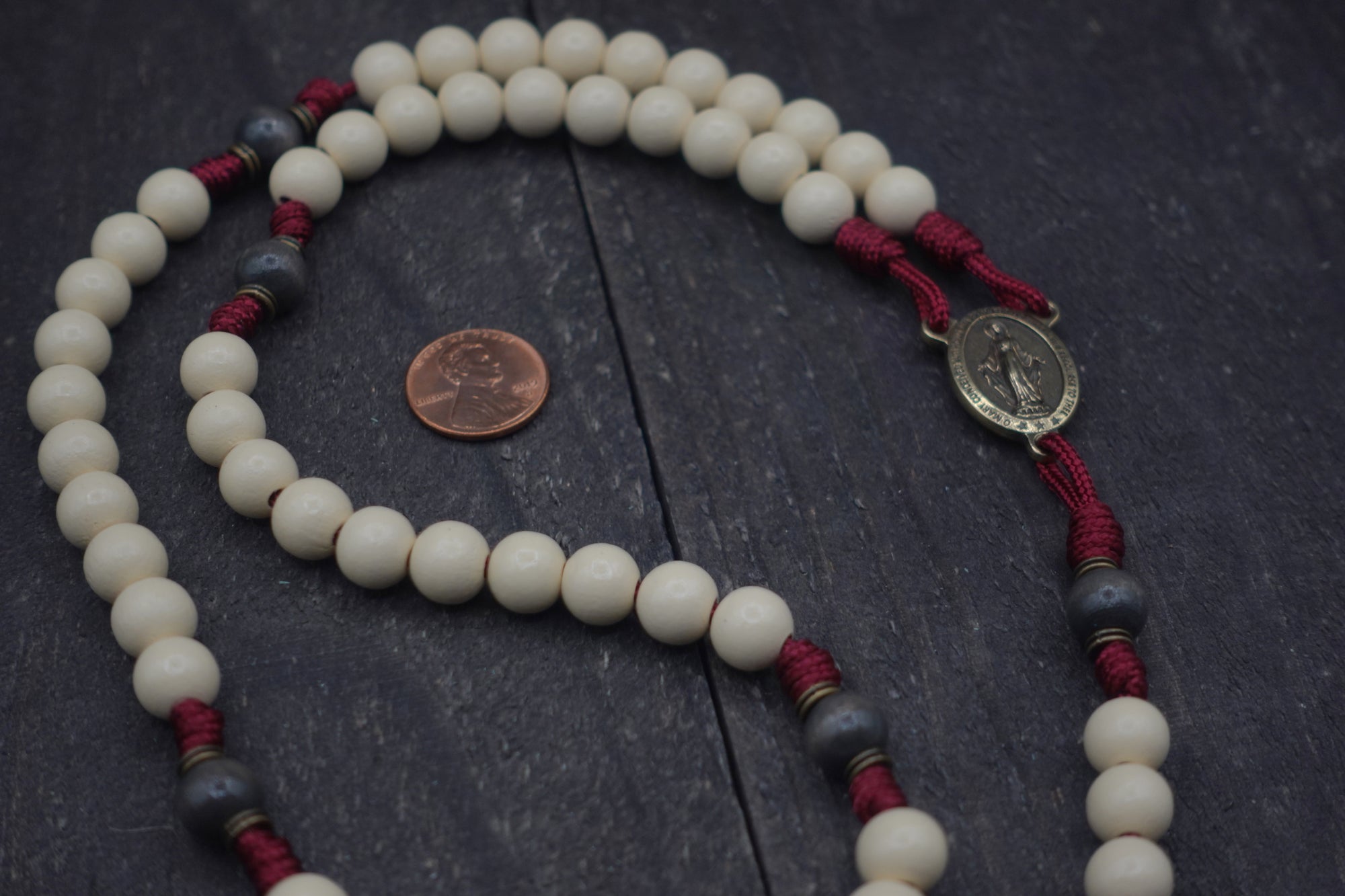 Rugged handmade Pope Leo XIV rosary crafted in Fargo ND with bronze crucifix and charcoal wood beads