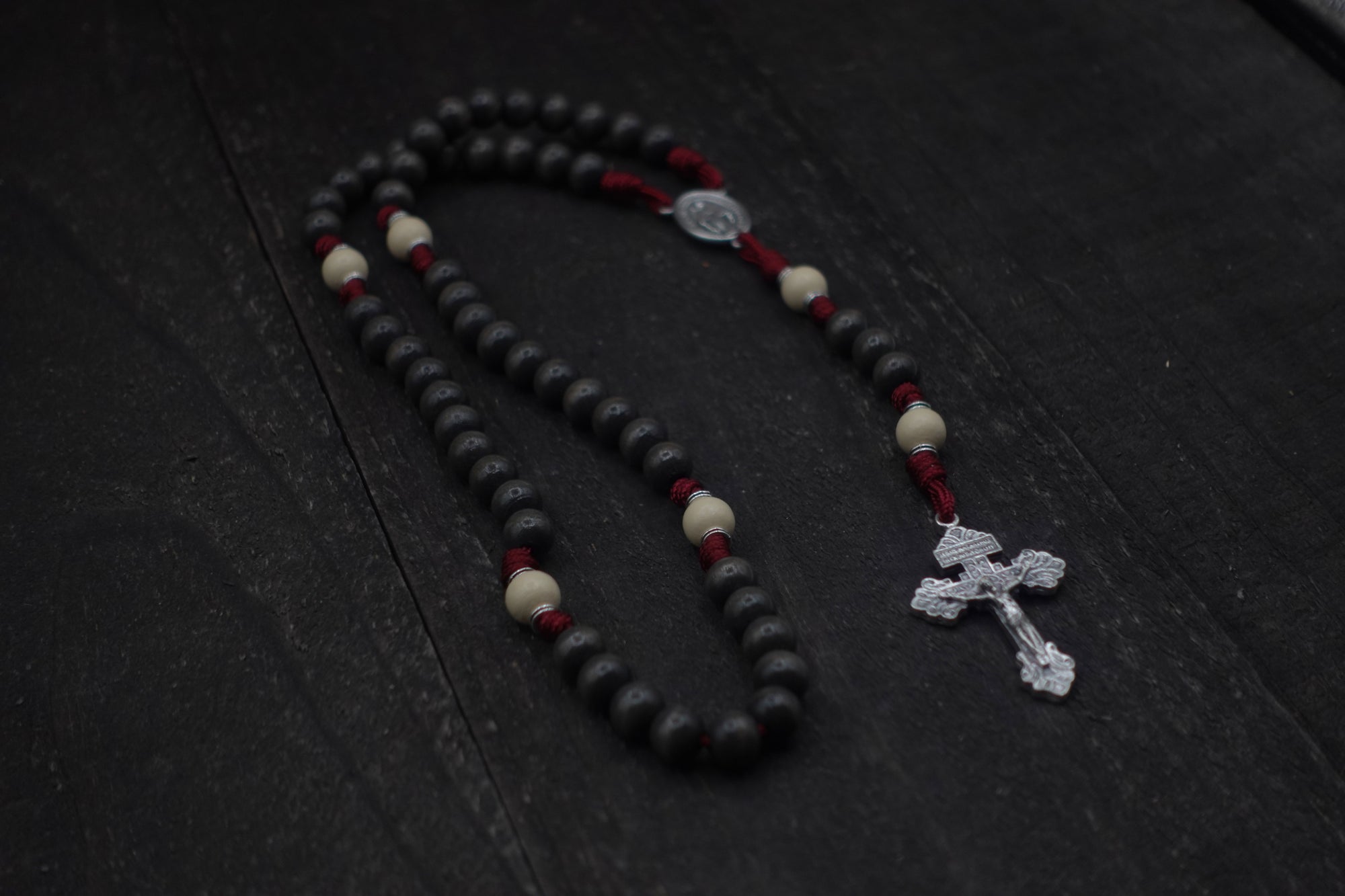 Handcrafted Pope Leo XIV rosary for daily prayer featuring silver crucifix and charcoal wooden beads