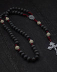 Handcrafted Pope Leo XIV rosary for daily prayer featuring silver crucifix and charcoal wooden beads