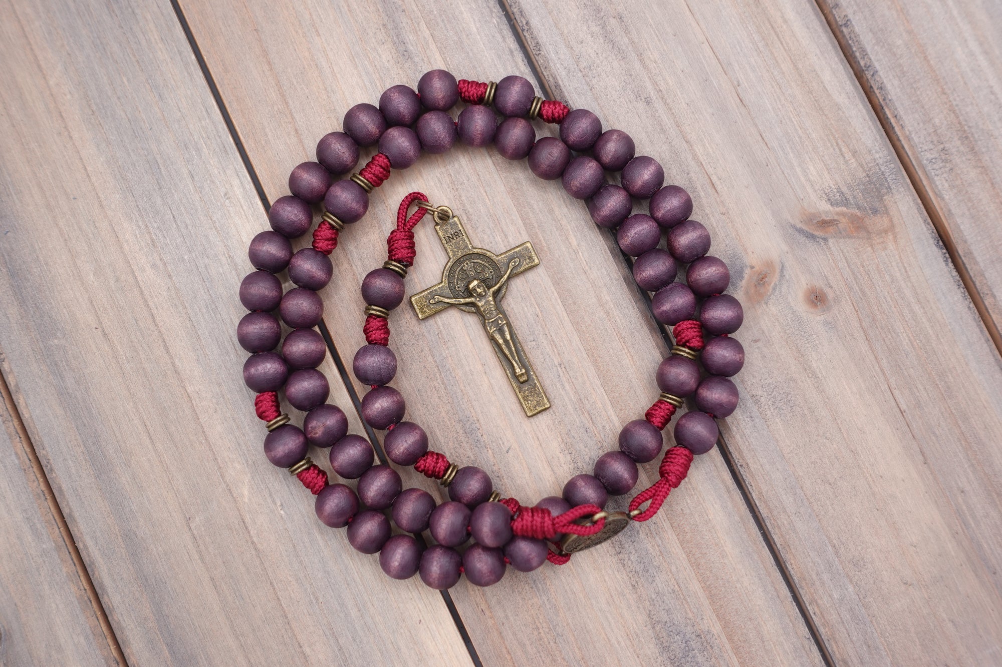 Rugged handmade Roma Victor rosary crafted in Fargo ND with bronze crucifix and purple wood beads