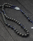 Handcrafted rosary featuring charcoal wood beads, silver crucifix, and Miraculous Medal centerpiece