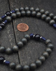 Close-up of charcoal and black wooden beads on Sanctus rosary showing heirloom craftsmanship