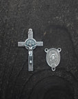 Silver crucifix detail symbolizing strength and devotion on handmade Sanctus rosary
